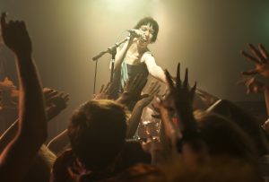 Woman singing into microphone