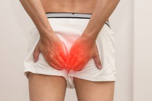 Midsection Of Man With Hands On Buttocks