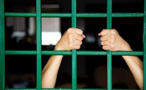 Hand Holding House Grille. Home Quarantine Concept