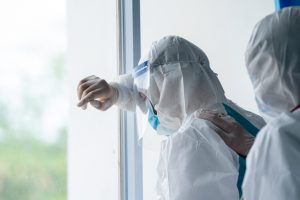 Doctor wearing protective suit to fight coronavirus pandemic covid-2019.