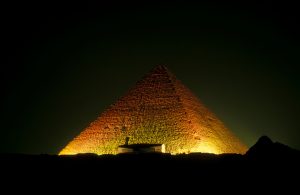 Illuminated Great Pyramid Of Giza Against Clear Sky At Night
