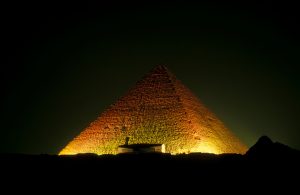 Illuminated Great Pyramid Of Giza Against Clear Sky At Night